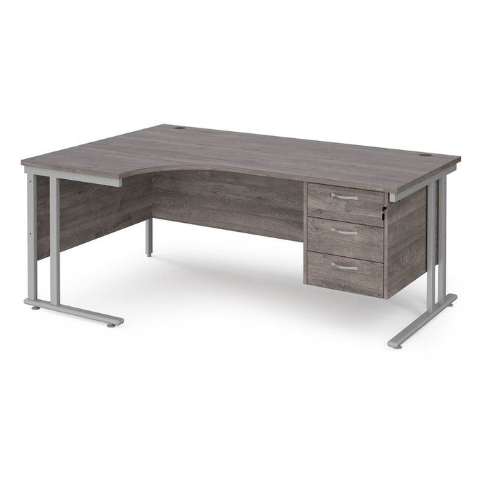 Maestro 25 left hand ergonomic corner desk with 3 drawer pedestal Desking Dams Grey Oak Silver 1800mm x 1200mm